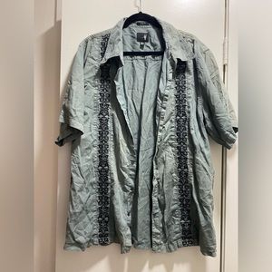 Vintage Green Hawaiian style button up shirt with floral like design